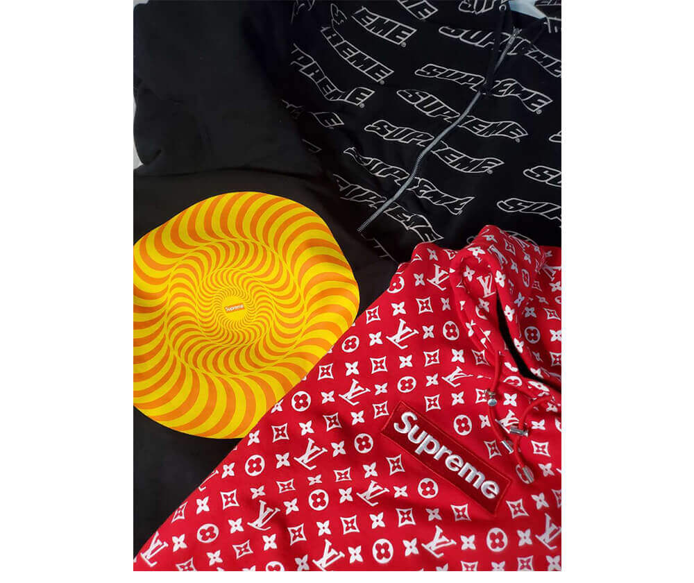 Louis Vuitton x Supreme In Signature Red Monogram Background